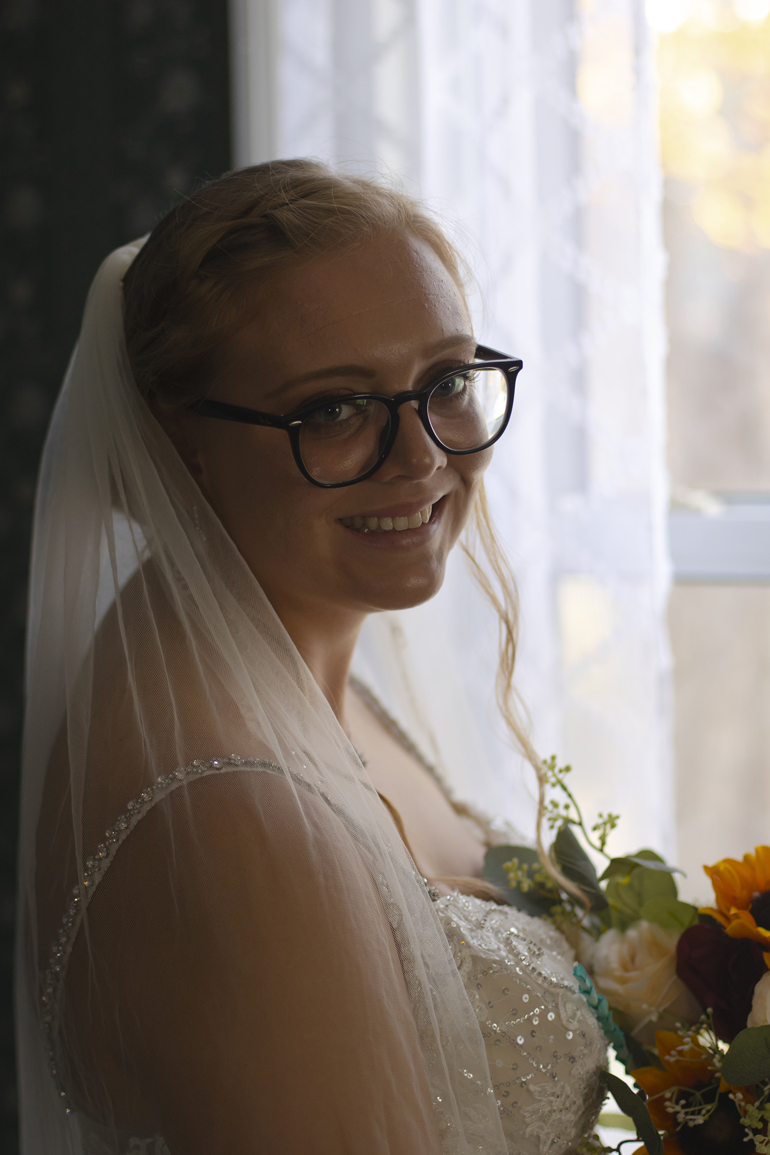 wedding-bride-white-closeup-window-turned-smile
