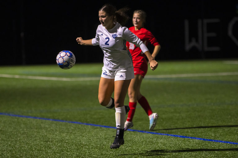 mvnu-womens-soccer-night-player-in-air
