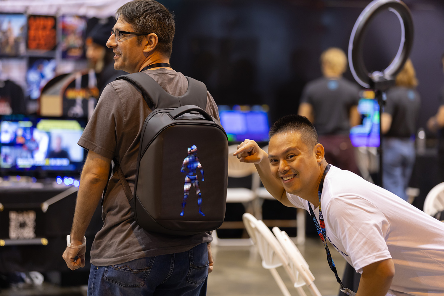 cgc-mk-backpack-girl-image-man-pointing-smiling